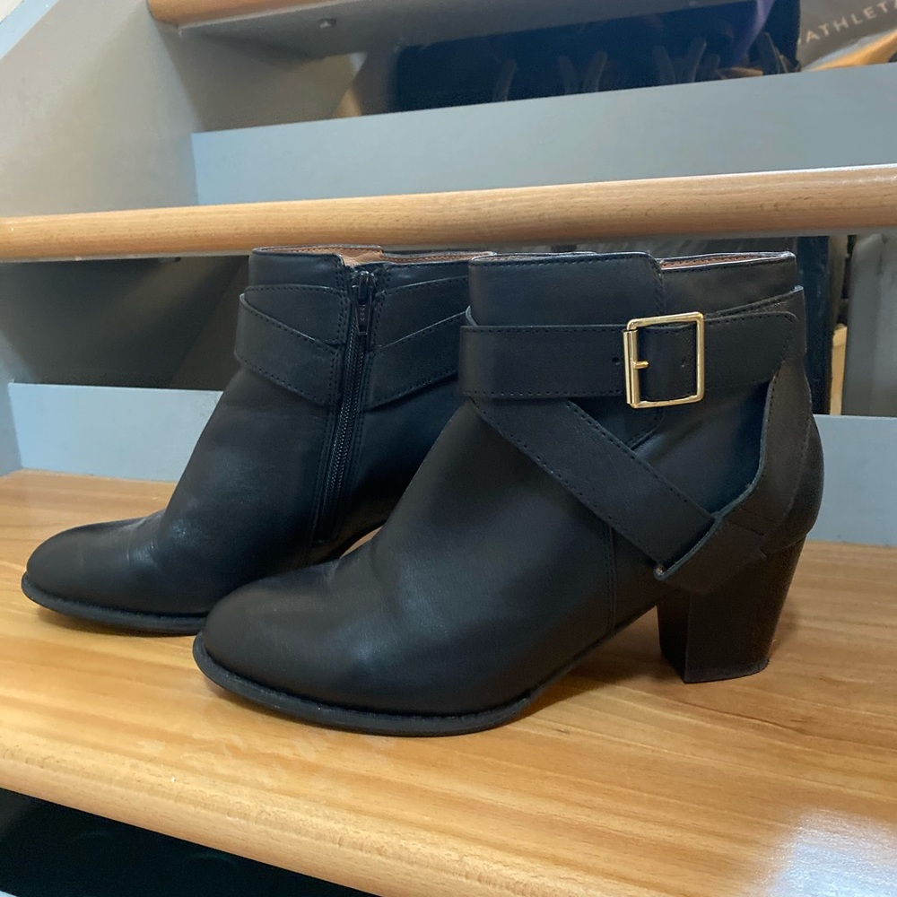 Black ankle booties with gold detail